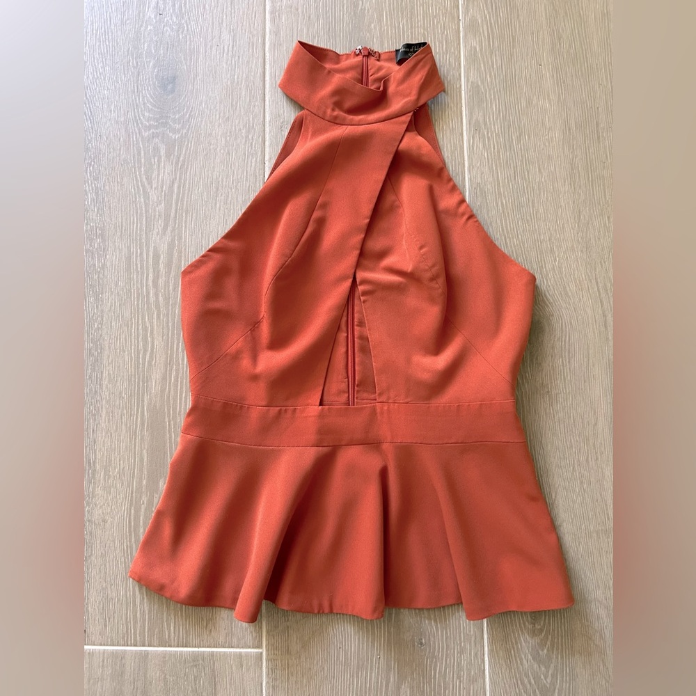 Sleeveless Peplum top with keyhole cut out at stomach